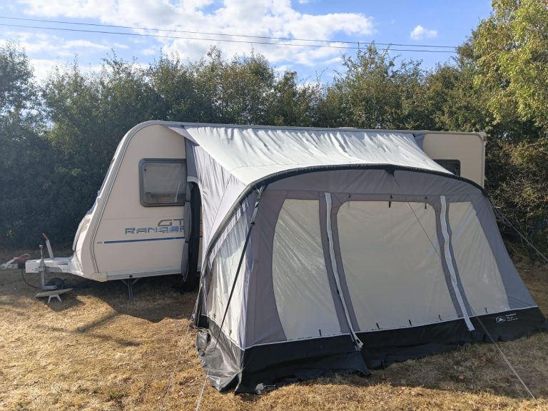 Long-term rental caravan and awning set up at a customer’s property in Gloucestershire during house rewiring work.