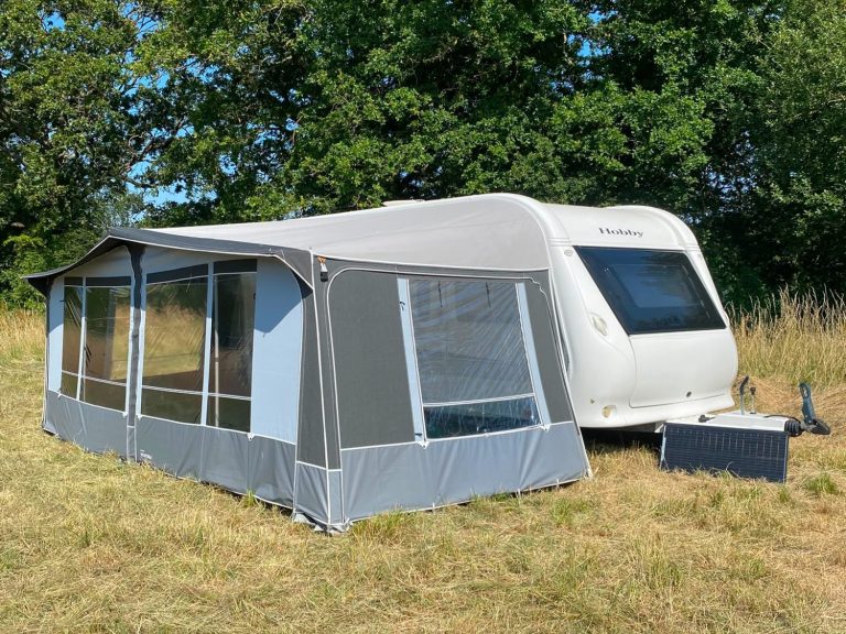 Long-term rental caravan with awning and off-grid solar setup for a four-week stay in Oxfordshire.